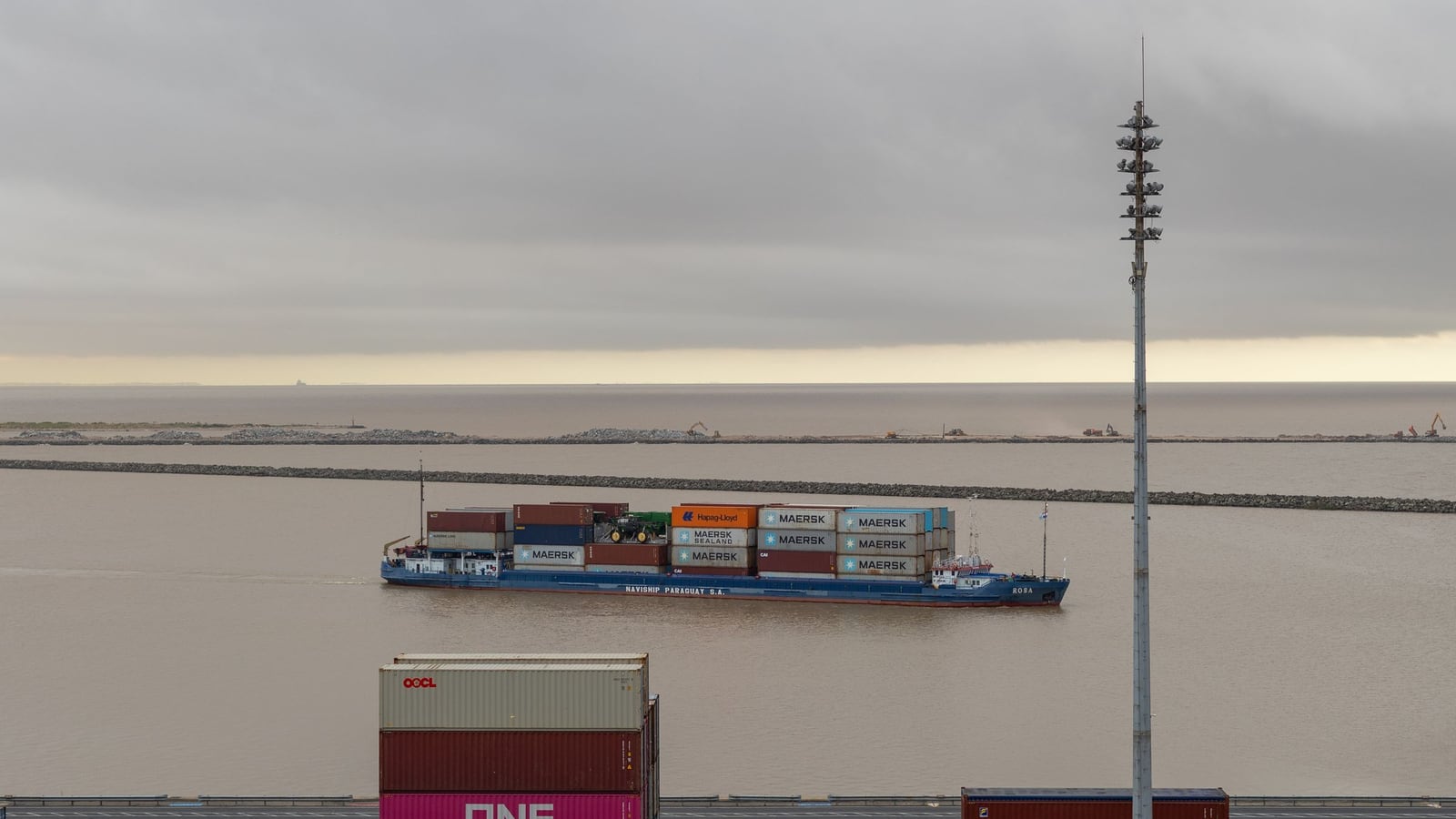 Container shipment moving through a logistics terminal